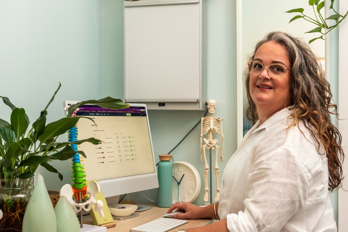 Woman using PatientNotes to document her osteopathic notes